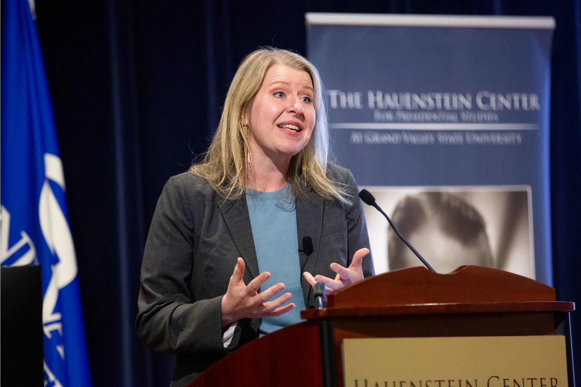 person speaking at a podium